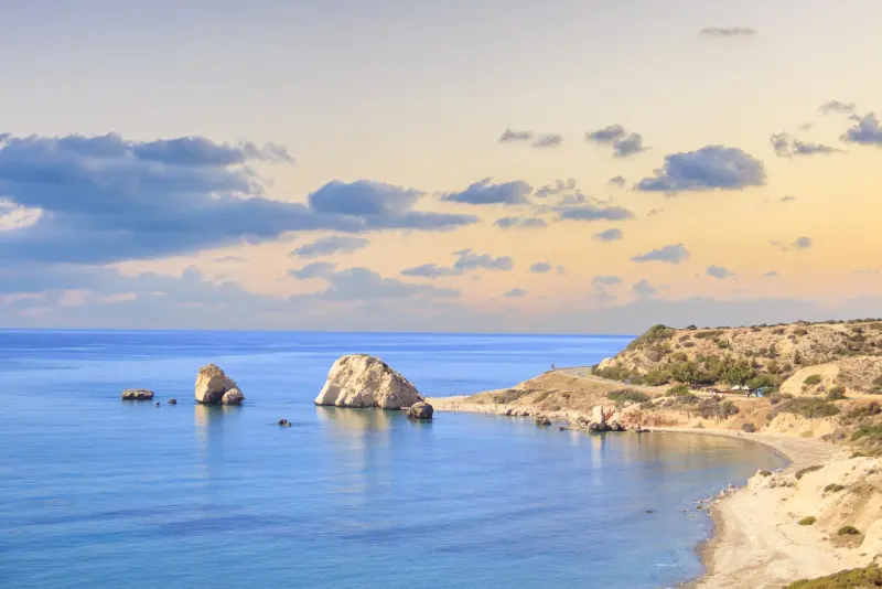 Golden-hour panorama over the bay of Aphrodite's Rock